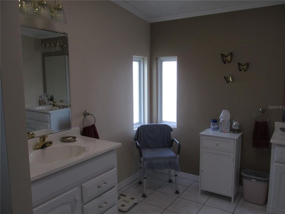 Second sink with space for chair and cabinet.