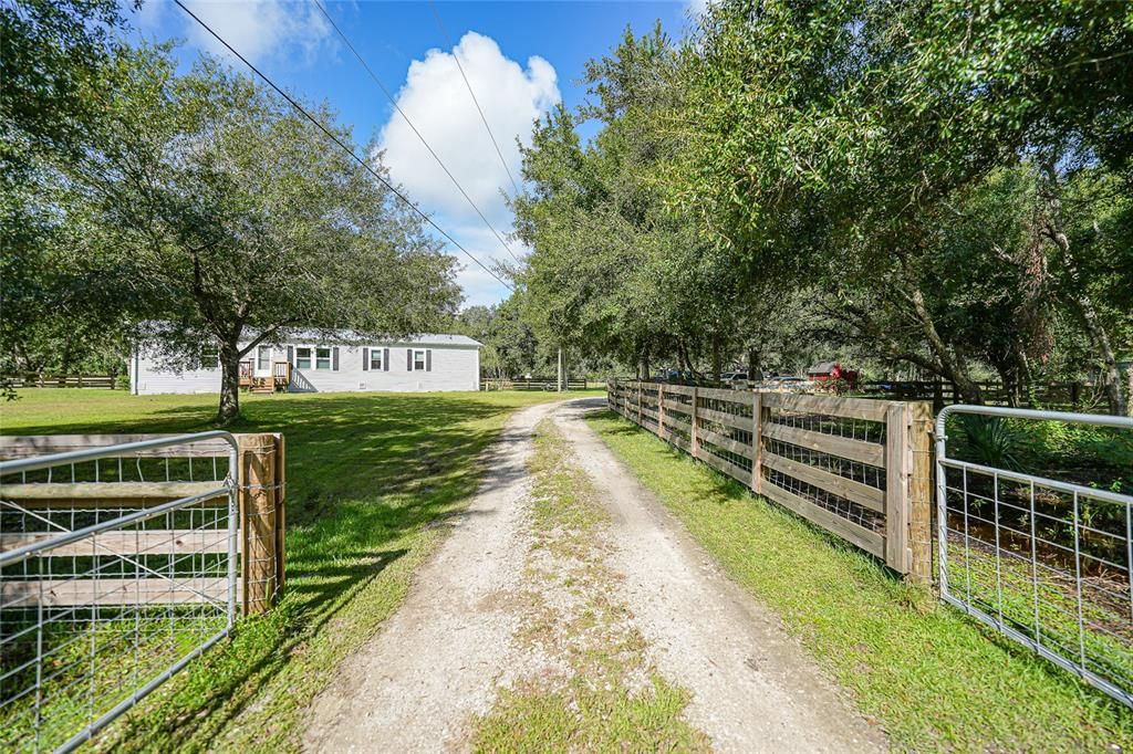 The lane has oposing gates for moving the animals to another pasture.