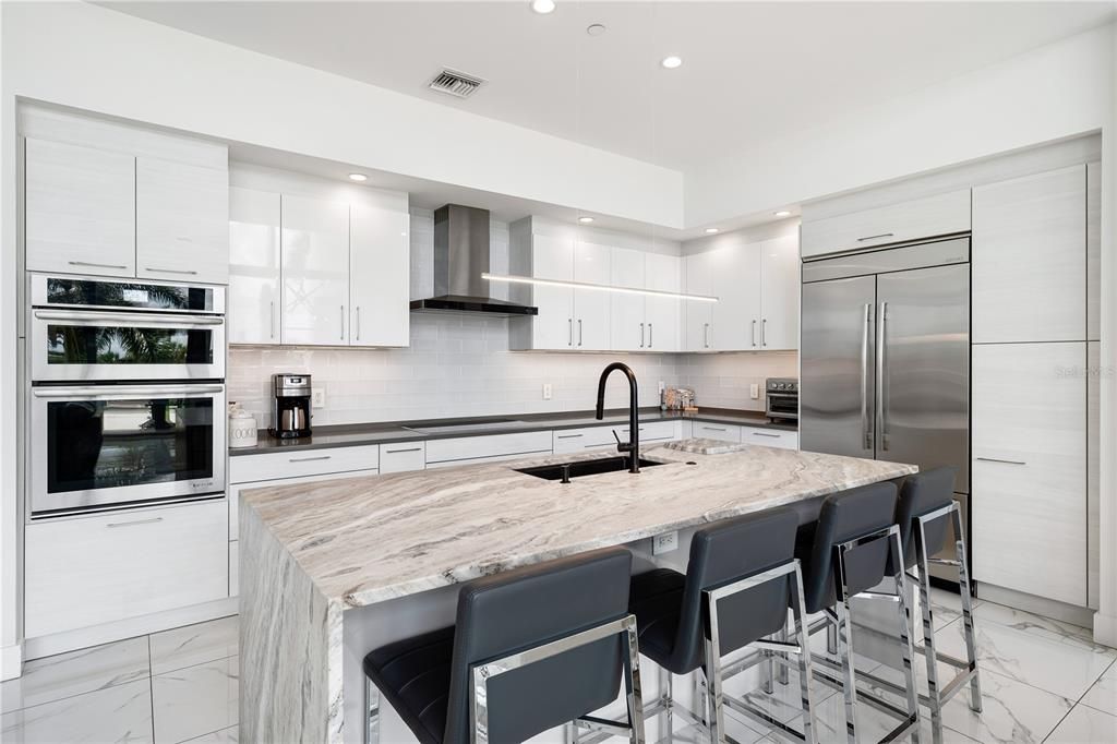 Brand new custom granite waterfall kitchen island.