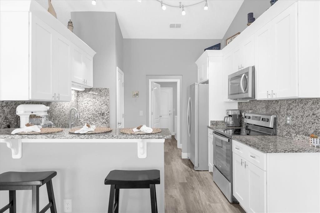 Updated Kitchen with Stainless Steel Appliances & Granite Counters & Backsplash