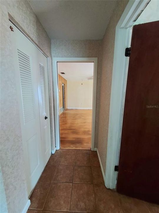 Hallway to family room from bedrooms.