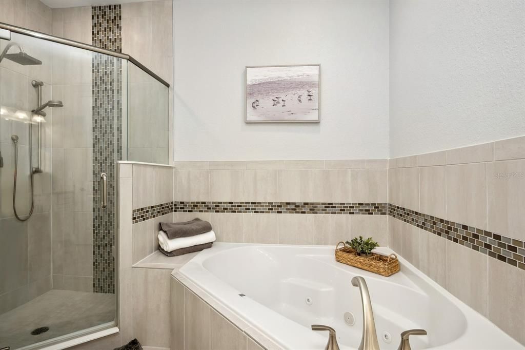 Primary bathroom with shower and garden tub