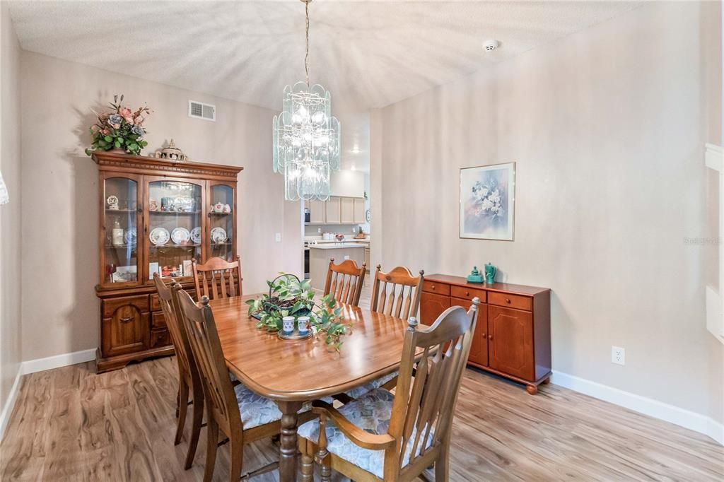 Formal Dining Room view from front entrance with large window facing front yard