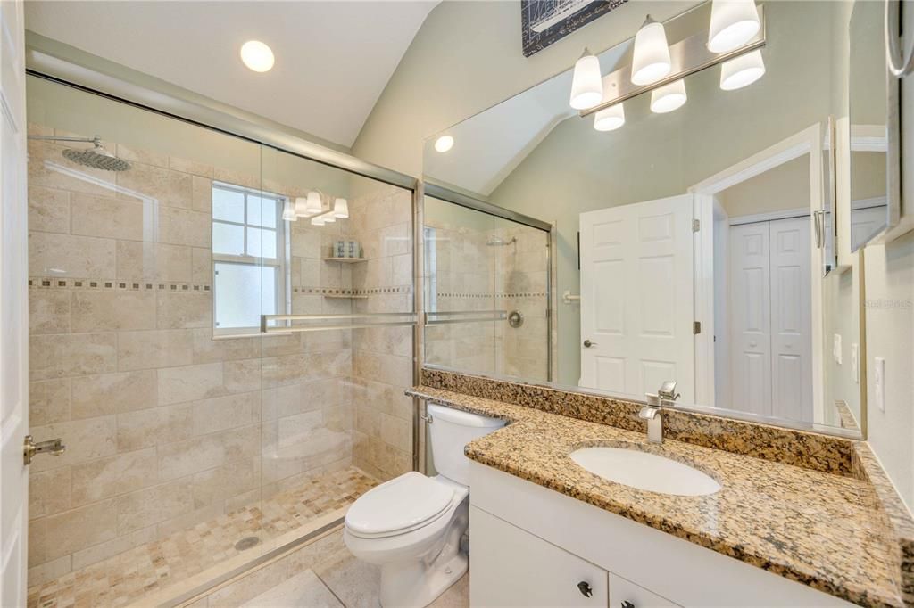 Second bathroom with plentiful counter space and large walk in shower, modern and updated