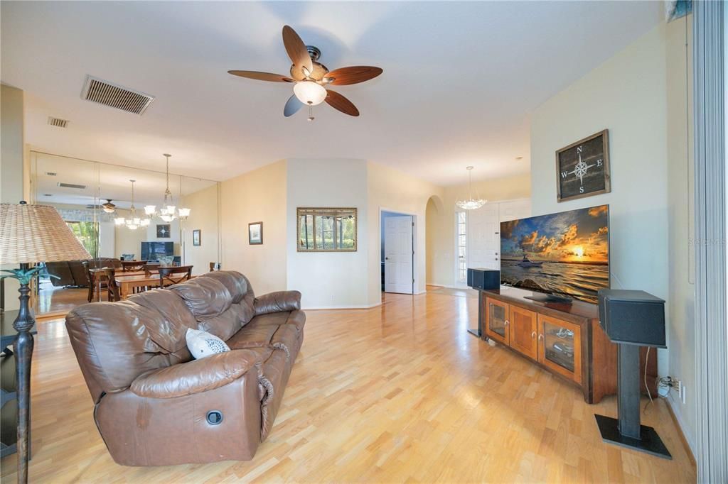 Corner pocket sliding doors connect family room to lanai/pool area