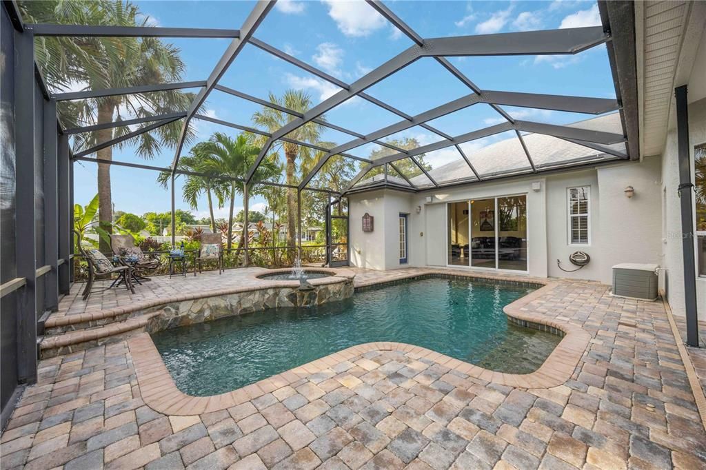 Pool is surfaced with Caribbean Blue Pebble tec mixed with abalone shell and spa is surfaced with Caribbean Blue Pebble sheen. Spa can accommodate 5-6 people