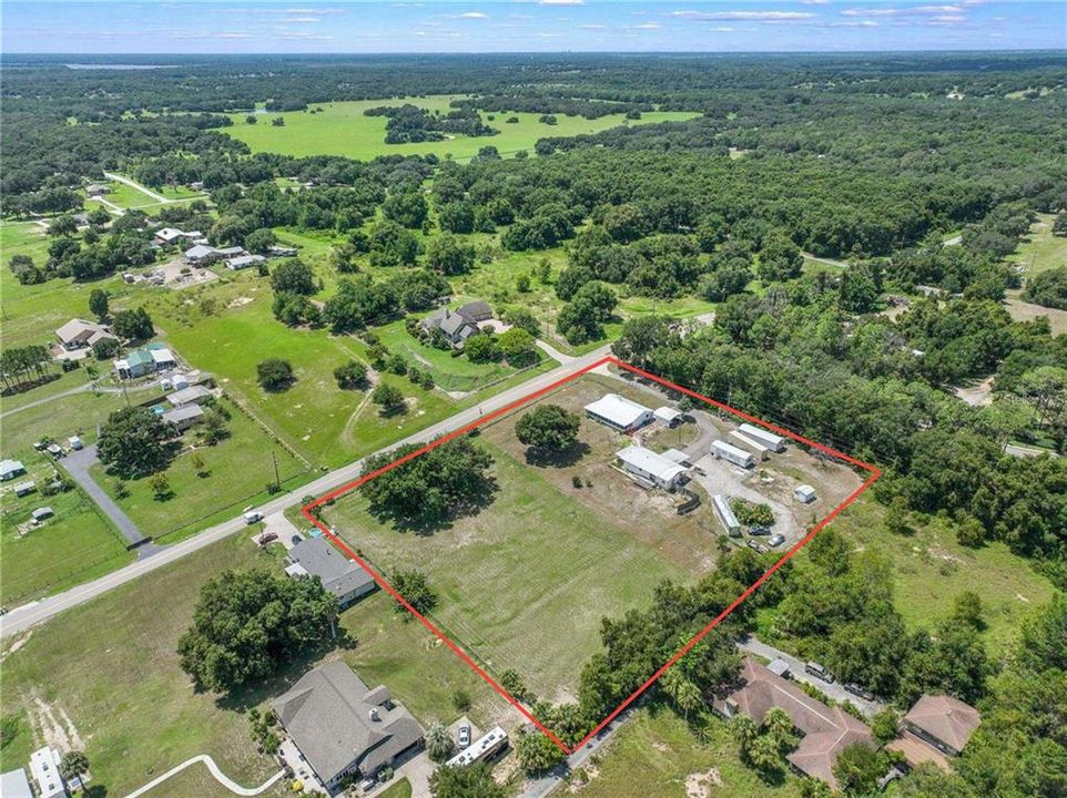 Looking for an “off the grid” lifestyle, family compound or some extra income potential? This unique property on OVER 2 ACRES with VIEWS OF LAKE GRIFFIN is the one for you!