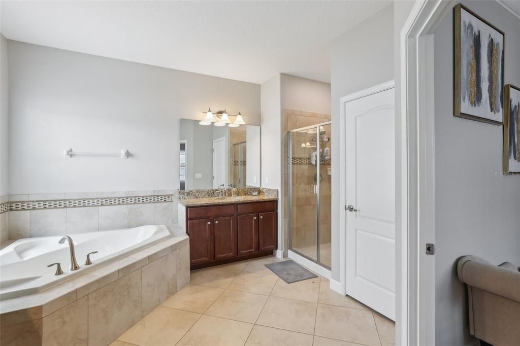 Start and end your day in the well appointed en-suite boasting DUAL/SPLIT VANITIES, a SOAKING TUB and separate glass enclosed shower.