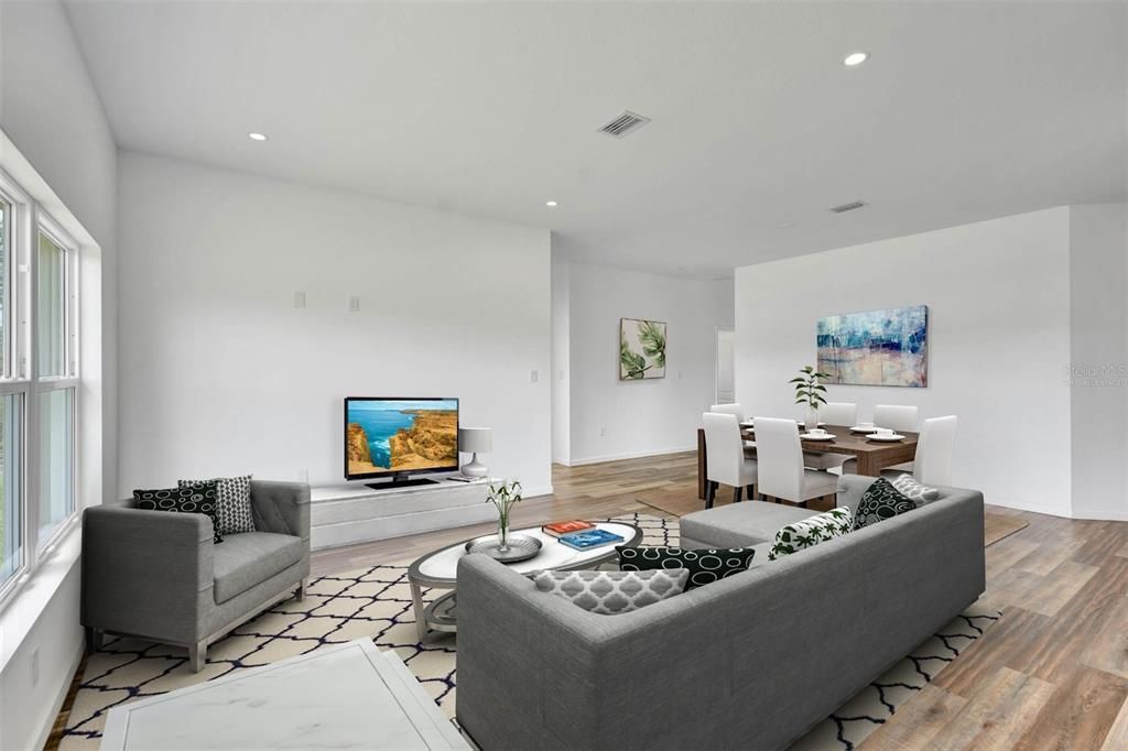 This photo is virtually staged view of the family room from the dinette area.