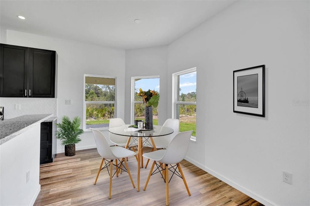 This is a view of the dining area and is virtually staged.