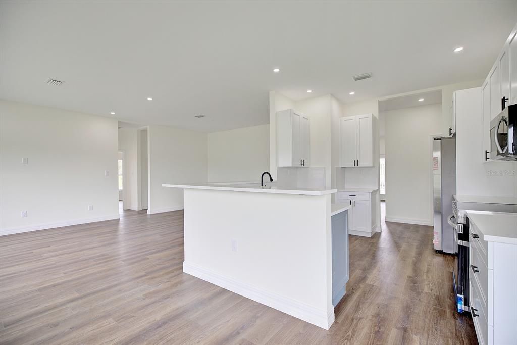 View into the kitchen from the dining area.