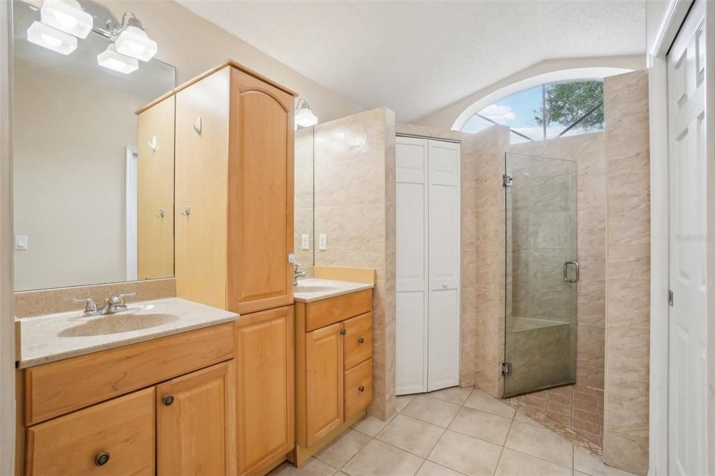 Dual sinks & walk in shower in primary bathroom