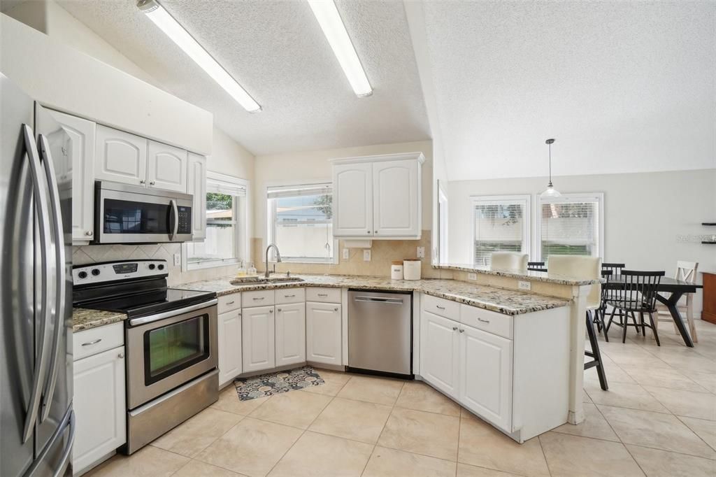 Kitchen opens to dining & living room