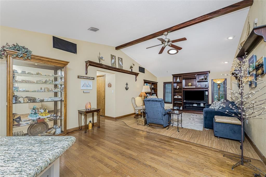 Living room leads to three bedrooms and office