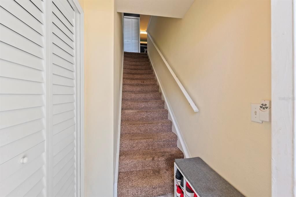 Extra storage closet at the bottom of the stairs.