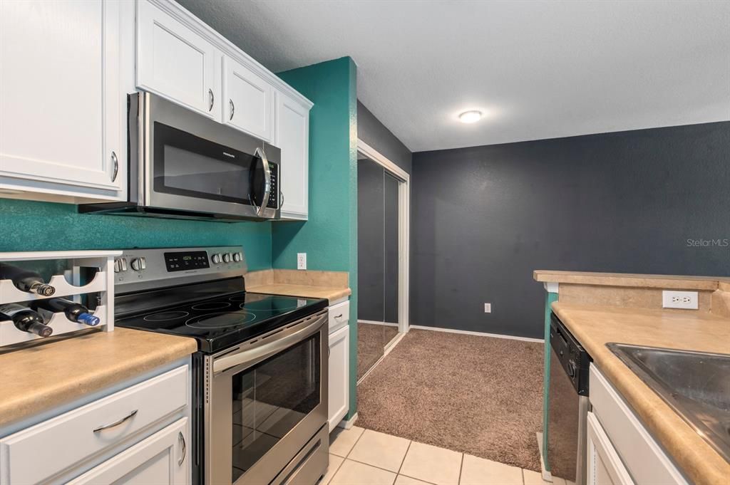 Kitchen pantry behind the sliding mirror doors.