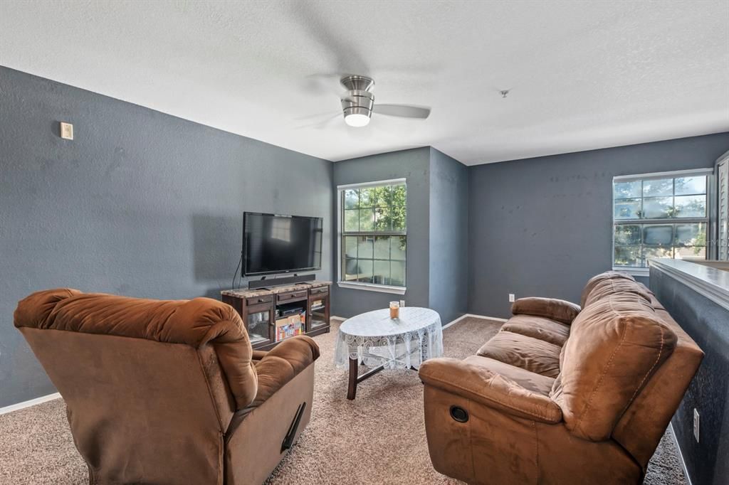 Living area with a small nook on the far side of the room.