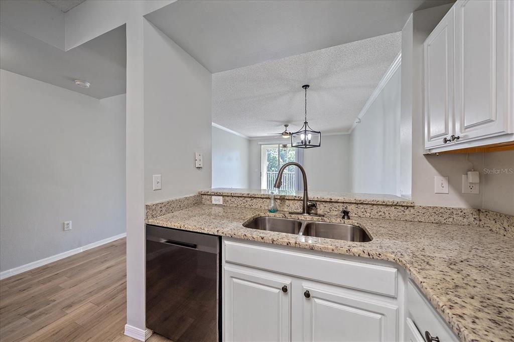 Granite Countertop, Breakfast Bar, White Shaker Cabinets, Stainless Steel Appliances