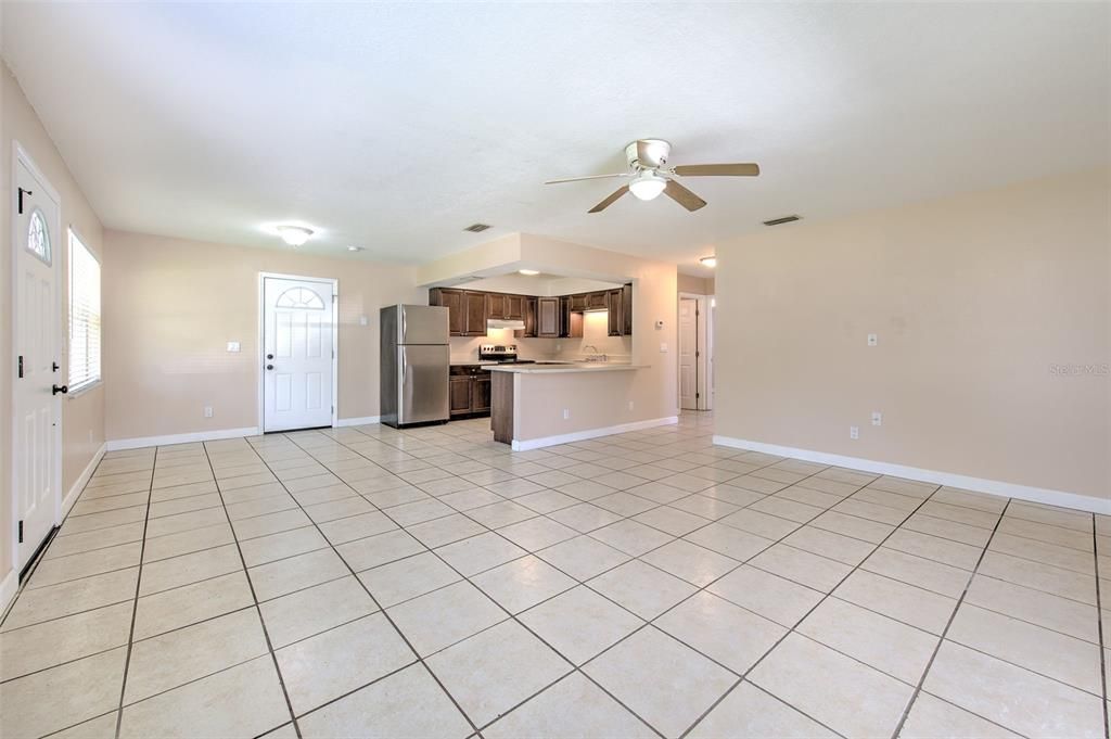 Living area with view to the dinette area and kitchen