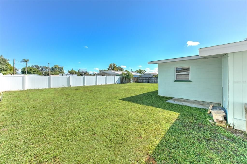 Left side of home behind the double gates