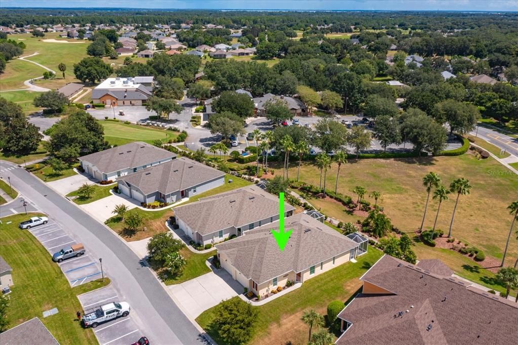 Aerial shot showing the community center and pool behind with easy access