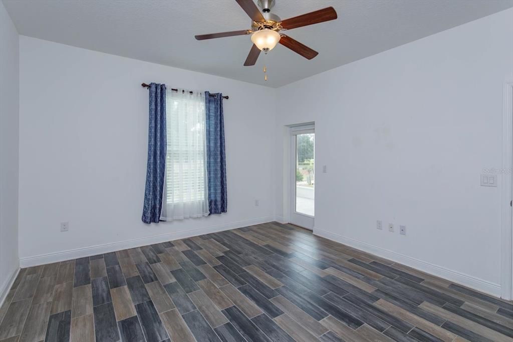 Master Bedroom with door leading to back patio