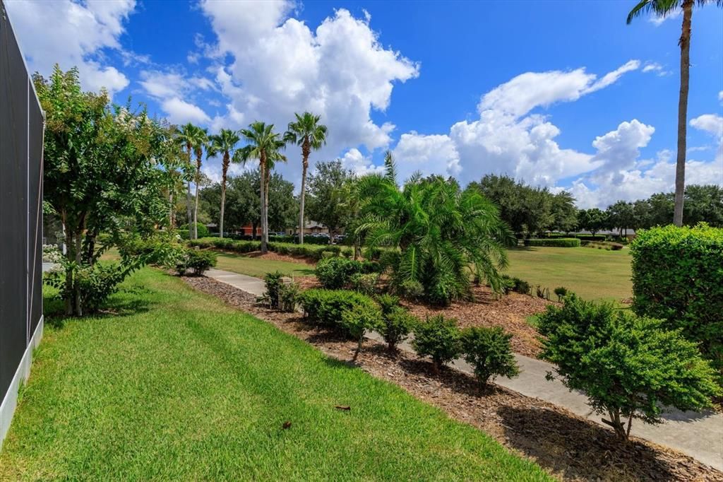 Back yard and pathway leading to restaurant and pool