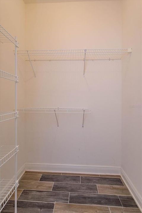 Two closets in master bedroom with one being a walk in