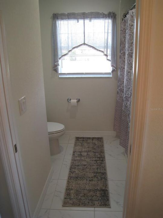 Upstairs bathroom w/tub & shower.