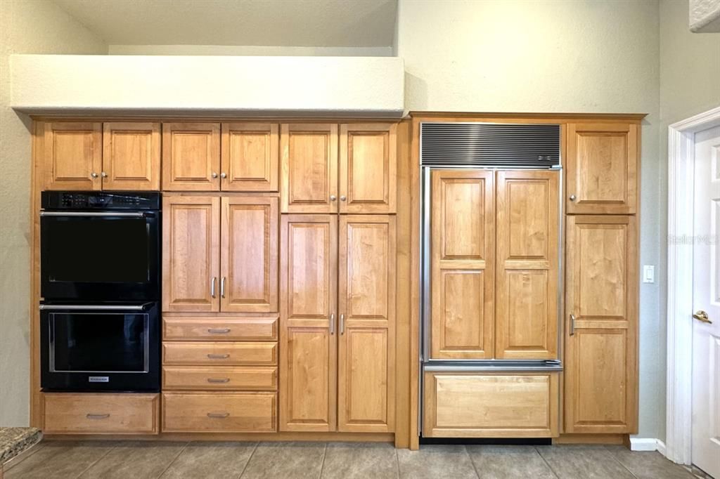 Kitchen double ovens, paneled sub zero Refrigerator and pantry