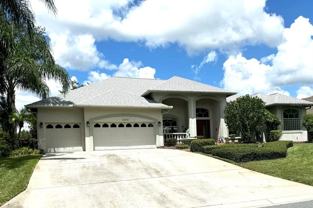 Front 3-car garage, front porch entry and right front side