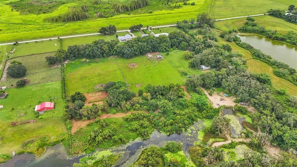 The back of the property has lake access. A dock can be built on this lake if you would like. The fishing is awesome here! The neighbors has fully cleared all their lake access and you could choose to do this too if you purchase this property!