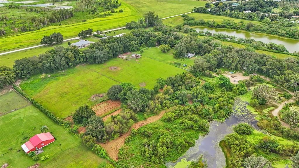 The back of the property has lake access. A dock can be built on this lake if you would like. The fishing is awesome here! The neighbors has fully cleared all their lake access and you could choose to do this too if you purchase this property!