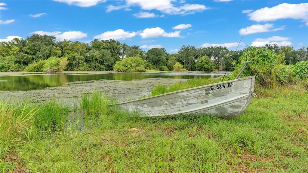 The back of the property has lake access. A dock can be built on this lake if you would like. The fishing is awesome here! The neighbors has fully cleared all their lake access and you could choose to do this too if you purchase this property!