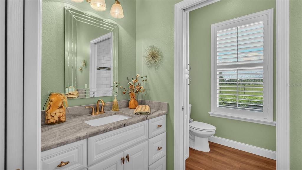 Hall bathroom with double vanities