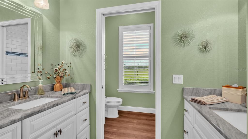 Hall bathroom with double vanities