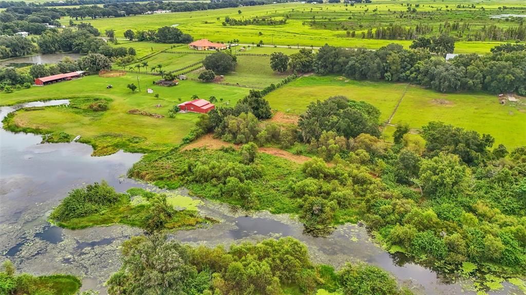 The back of the property has lake access. A dock can be built on this lake if you would like. The fishing is awesome here! The neighbors has fully cleared all their lake access and you could choose to do this too if you purchase this property!