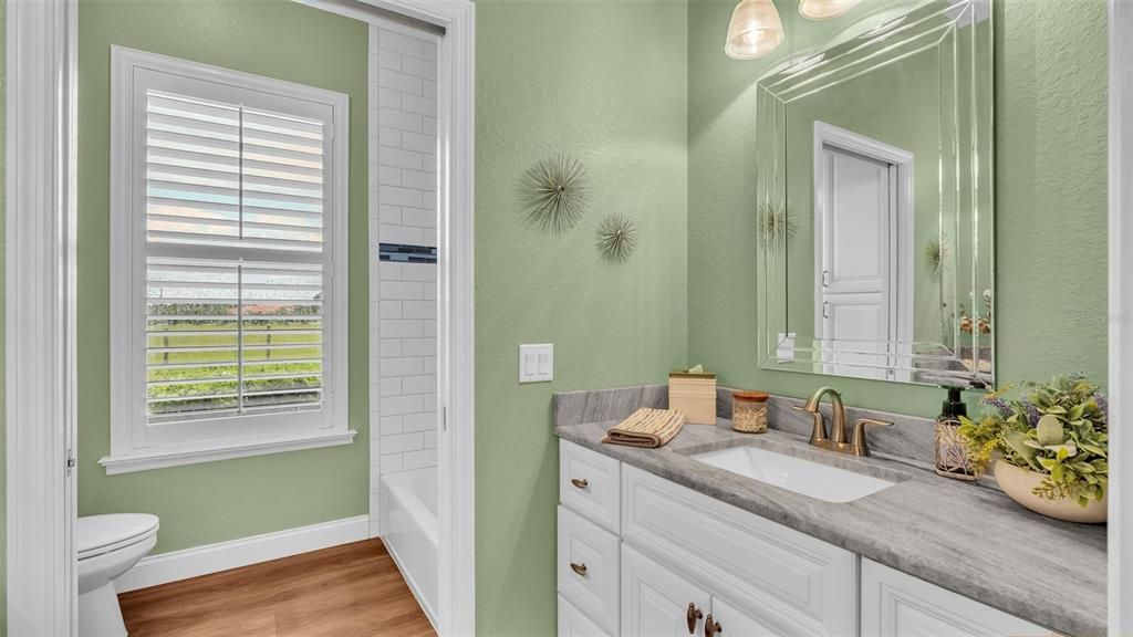 Hall bathroom with double vanities