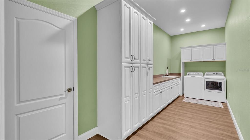 Dream laundry room with amazing custom storage cabinetry 20'10" x 7'8"