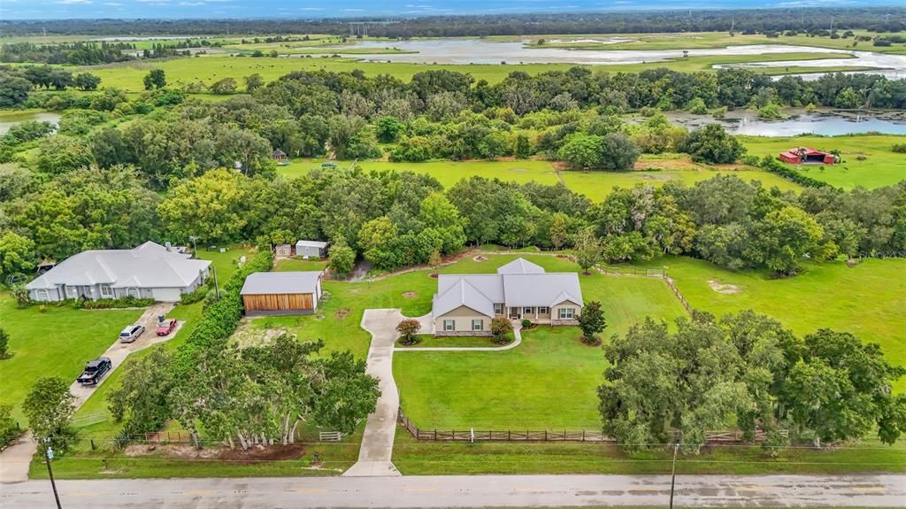 Custom built home on 2 parcels totaling 10.48 acres