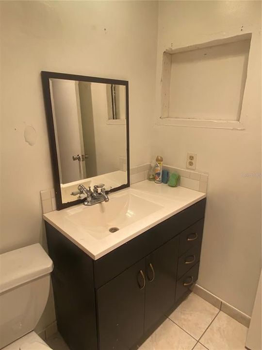 Updated vanity. ( Yes, the original medicine cabinet was removed. Can hang artwork, or add another medicine cabinet)