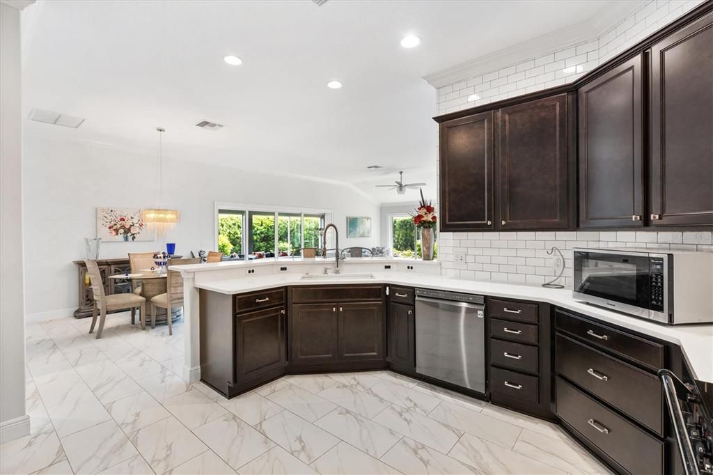 KITCHEN OPEN DIRECTLY TO DINING ROOM AND LIVING ROOM FOR GREAT ENTERTAINING