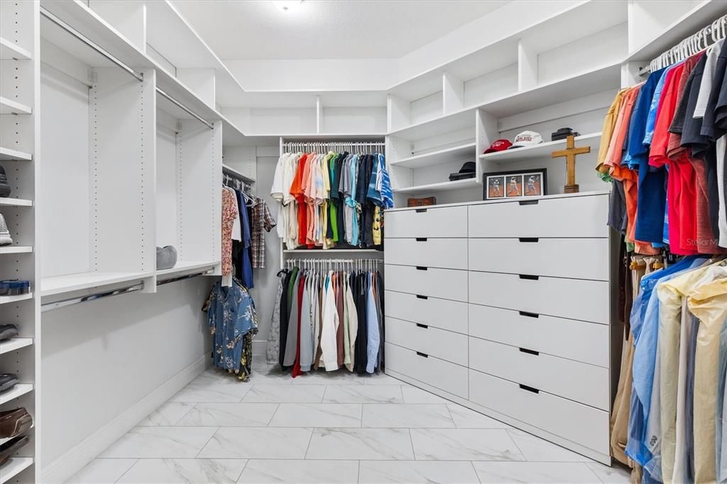 PRIMARY CLOSET IS HUGE!  UNBELIEVABLE BUILT IN DRAWERS AND SHELVING.