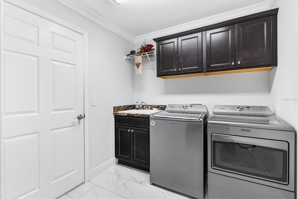 LAUNDRY ROOM HAS NEW MAYTAG WASHER AND DRYER