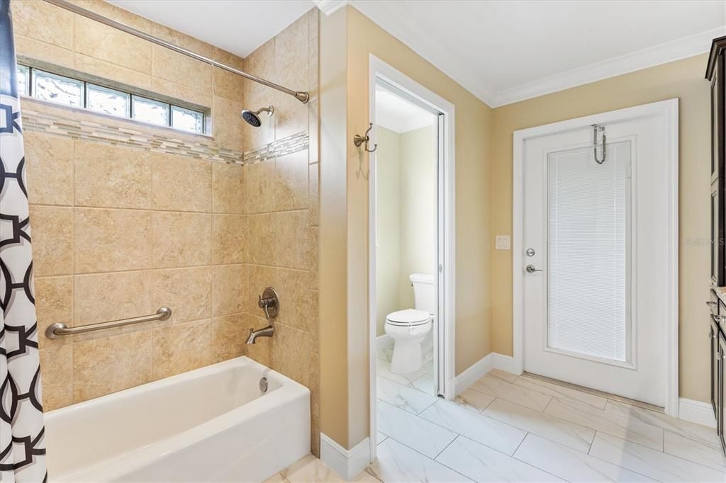 GUEST BATHROOM WITH DOOR TO LANAI