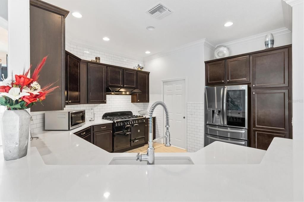 UPGRADED KITCHEN WITH NEW LG FRENCH DOOR REFRIGERATOR, DISHWASHER, AND FANTASTIC STOVE.