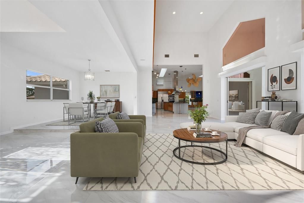 Living room featuring volume ceiling