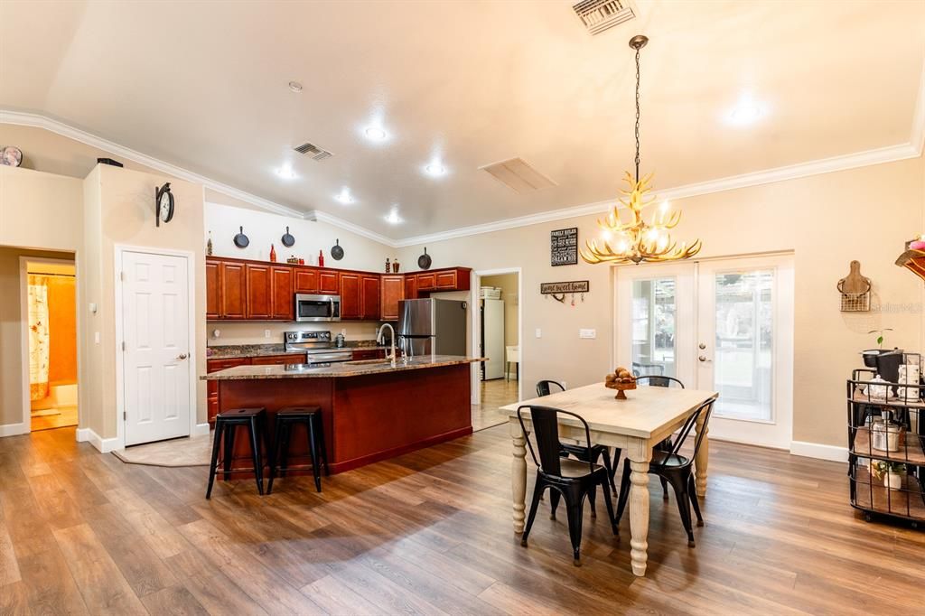 Dining and kitchen combined with newer wood cabinets, applicances and granite counter tops