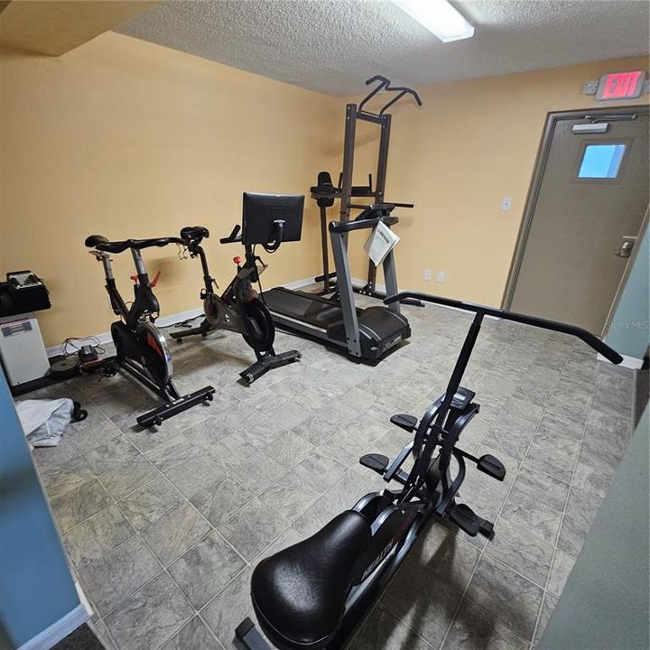 Small work out area located in the clubhouse area near the pool