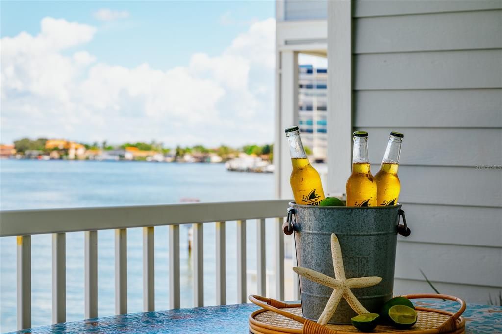 Cheers to waterfront living! Enjoy your favorite drink on the balcony with these stunning views as your backdrop—where every day feels like a vacation.